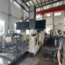 紐威6028龍門，工作臺6x2米，三軸行程6200x3200x1000，門寬2.8米.
